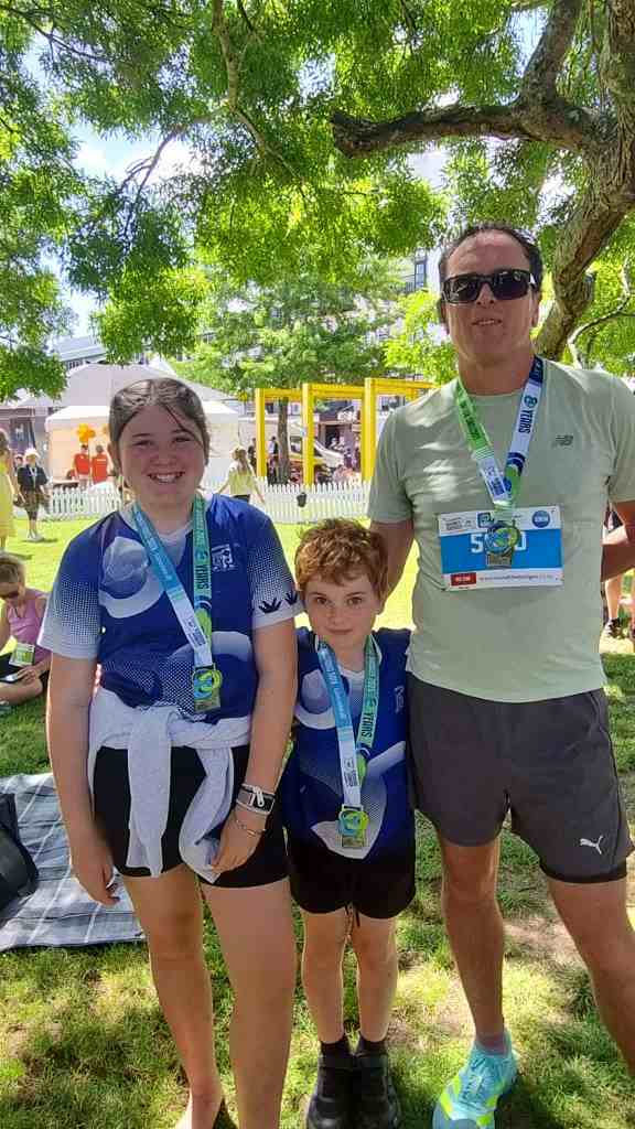 “Round the Bridges 2025 finish area with family”